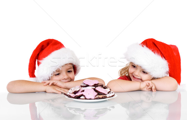Happy kids near a plate with christmas cookies Stock photo © ilona75