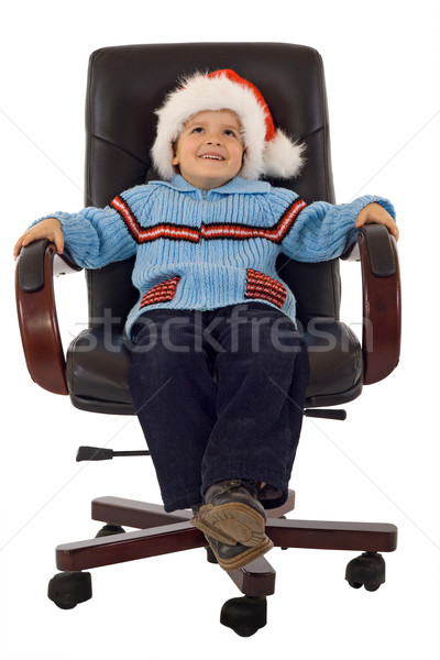 Happy boy waiting santa in a revolving armchair - studio shot Stock photo © ilona75