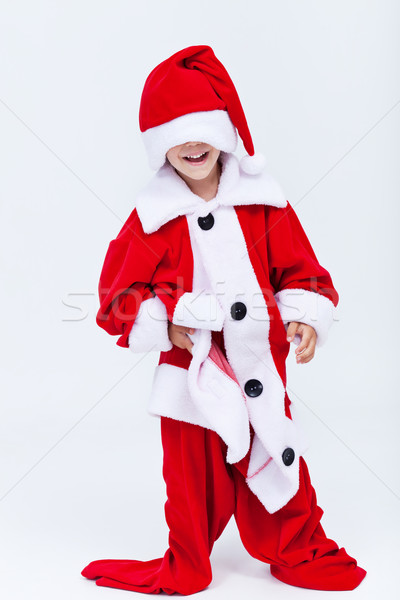 Happy santa helper trying on very large christmas costume Stock photo © ilona75