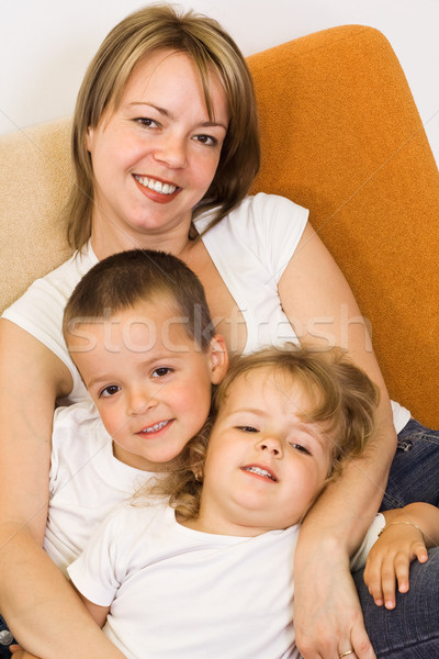 Stock photo: Woman with kids on the sofa