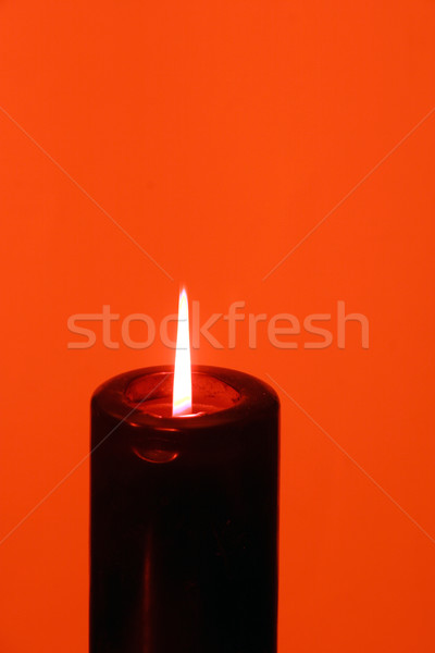 Black candle on red backdrop  Stock photo © Imagecom