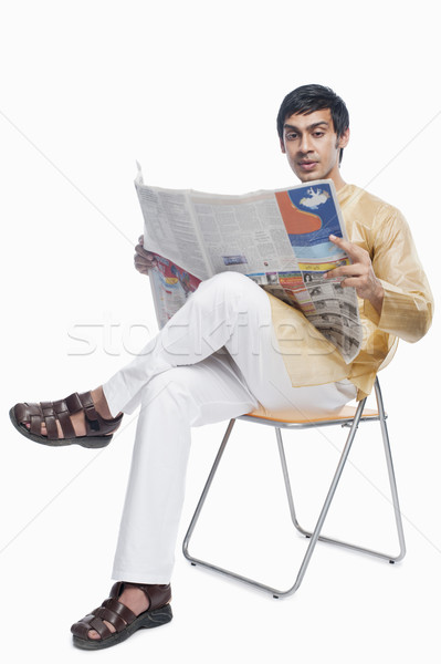 Bengali man reading a newspaper Stock photo © imagedb