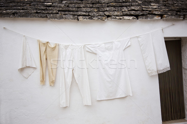 Clothes drying outside a trulli house Stock photo © imagedb