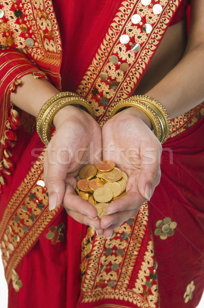 Nő fényes piros tart arany érmék portré Stock fotó © imagedb