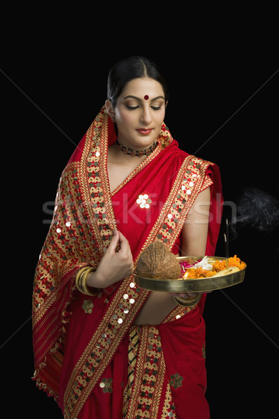 Kadın parlak kırmızı dini teklif Stok fotoğraf © imagedb