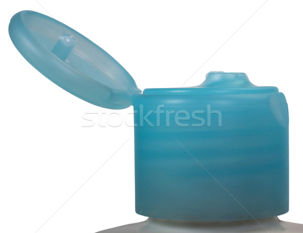 Primer plano CAP crema hidratante botella azul aislado Foto stock © imagedb