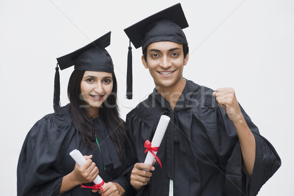 Cuplu absolvire om comunicare succes Imagine de stoc © imagedb