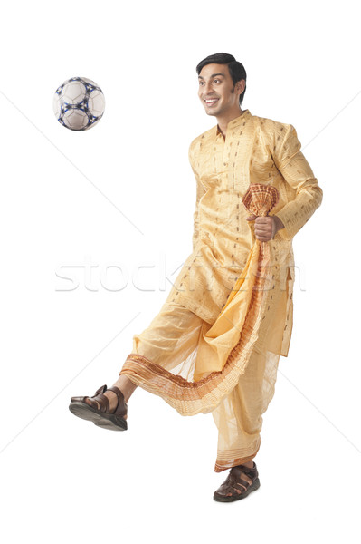 Bengali man playing with a soccer ball Stock photo © imagedb