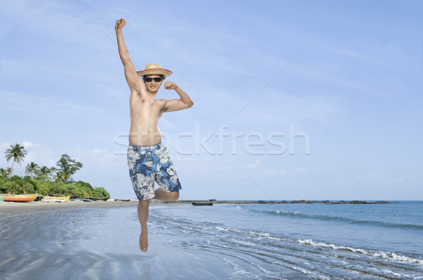 [[stock_photo]]: Homme · sautant · plage · ciel · eau · énergie