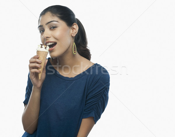 Portré nő eszik fagylalt kék fiatal Stock fotó © imagedb