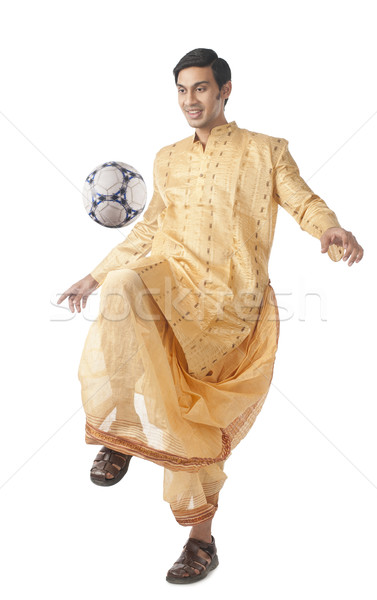 Bengali man playing with a soccer ball Stock photo © imagedb