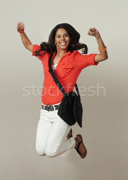 Zdjęcia stock: Kobieta · skoki · uśmiechnięty · pięść · 20s · pionowy