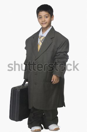 Portré fiú visel túlméretezett öltöny tart Stock fotó © imagedb