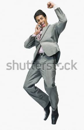 Biznesmen mówić telefonu komórkowego uśmiech człowiek szczęśliwy Zdjęcia stock © imagedb