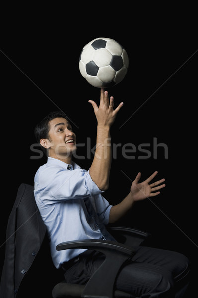 Imprenditore bilanciamento soccer ball dito uomo divertimento Foto d'archivio © imagedb