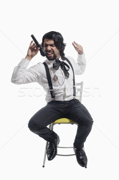 Singer holding a mike and singing Stock photo © imagedb