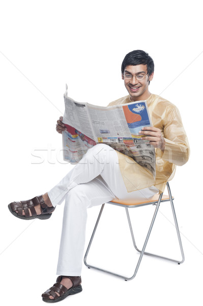 Bengali man reading a newspaper Stock photo © imagedb