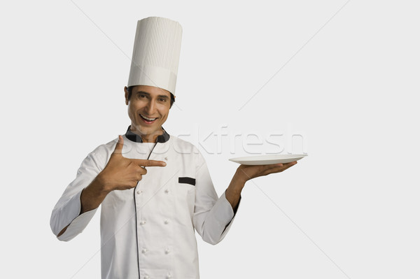 Portré szakács tart tányér mosolyog ital Stock fotó © imagedb