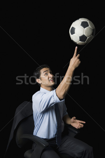 Imprenditore bilanciamento soccer ball dito divertimento giovani Foto d'archivio © imagedb