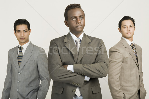 Drei Geschäftsleute stehen zusammen Business Geschäftsmann Stock foto © imagedb