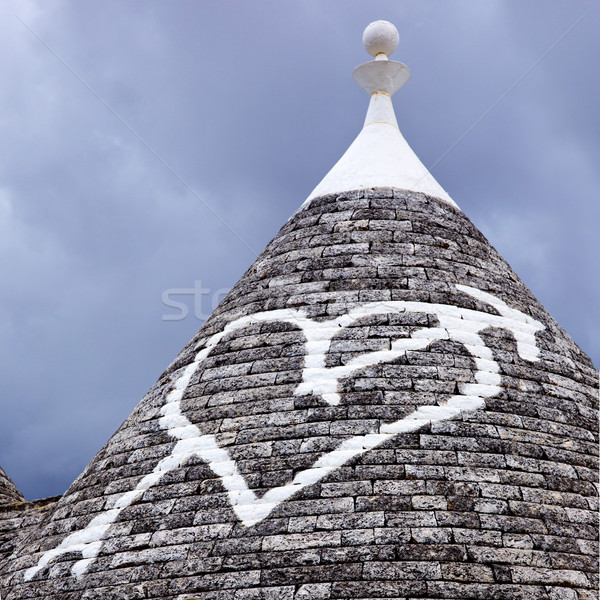 Low angle view of a heart shape painted on a trulli house Stock photo © imagedb