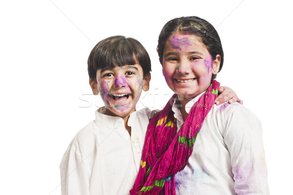 Portrait of brother and sister celebrating Holi festival Stock photo © imagedb