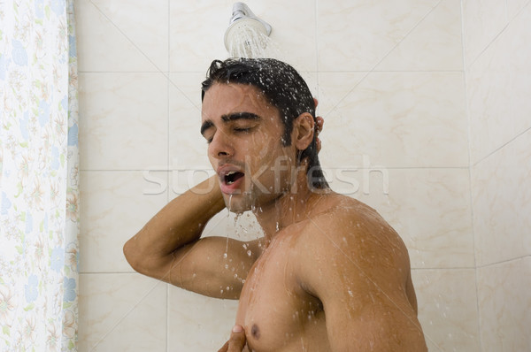 Közelkép férfi elvesz zuhany otthon fürdőkád Stock fotó © imagedb