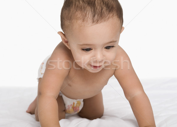 Stock photo: Baby boy crawling and smiling