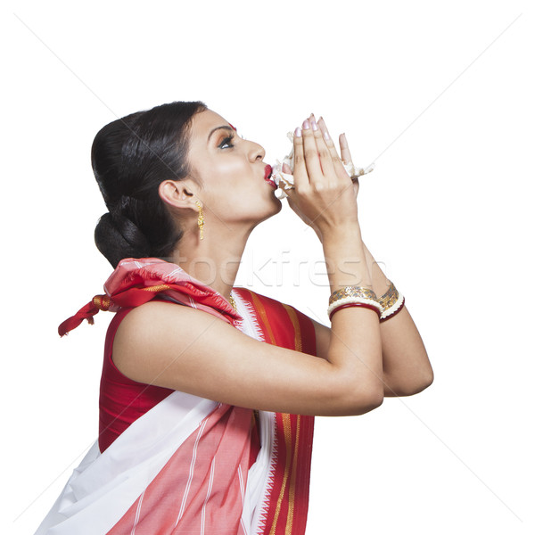 Traditional Bengali woman blowing shankha Stock photo © imagedb