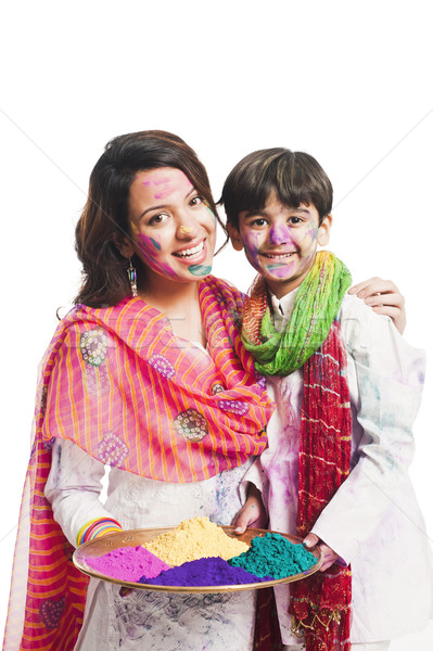 Woman celebrating Holi festival with her son Stock photo © imagedb