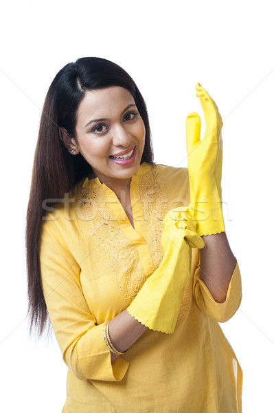 Portrait of a happy woman wearing gloves Stock photo © imagedb