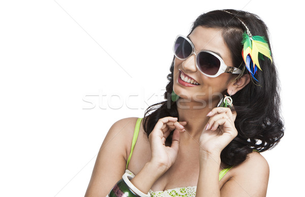 Beautiful young woman posing with sunglasses Stock photo © imagedb