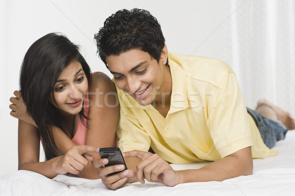 çift bakıyor cep telefonu yatak teknoloji iletişim Stok fotoğraf © imagedb