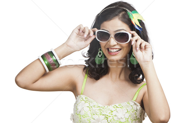 Beautiful young woman posing with sunglasses Stock photo © imagedb