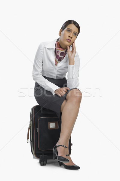 Levegő hosztesz ül csomagok gondolkodik lábak Stock fotó © imagedb