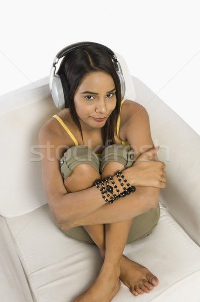 Nő hallgat technológia jókedv szék fiatal Stock fotó © imagedb