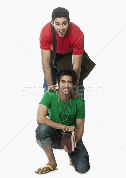 Porträt zwei Universität Studenten lächelnd Buch Stock foto © imagedb