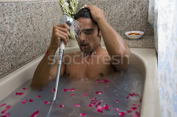Férfi elvesz zuhany fürdőkád pihen függöny Stock fotó © imagedb