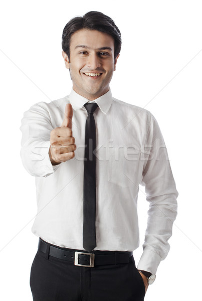 Businessman gesturing thumbs up sign Stock photo © imagedb