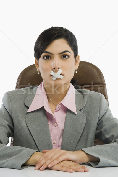Femme d'affaires ruban adhésif bouche contrôle identité idées [[stock_photo]] © imagedb