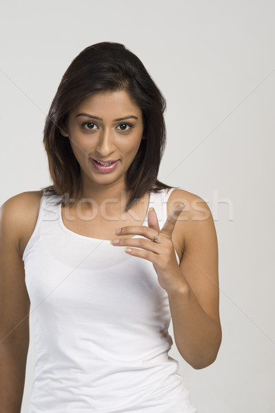 портрет женщину указывая пальца молодые счастье Сток-фото © imagedb
