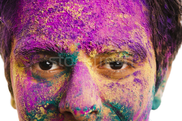 Mans face covered with powder paint during Holi festival Stock photo © imagedb