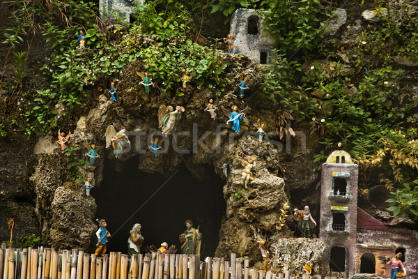 Cave and miniature houses on the rocks Stock photo © imagedb