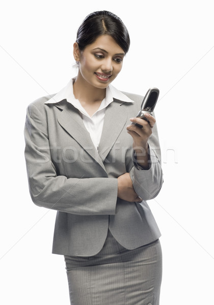 üzletasszony néz mobiltelefon fehér nő igazgató Stock fotó © imagedb