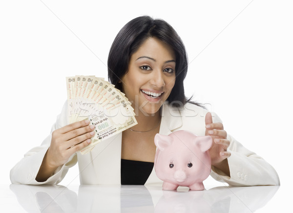 Zakenvrouw indian papiergeld spaarvarken vrouw Stockfoto © imagedb