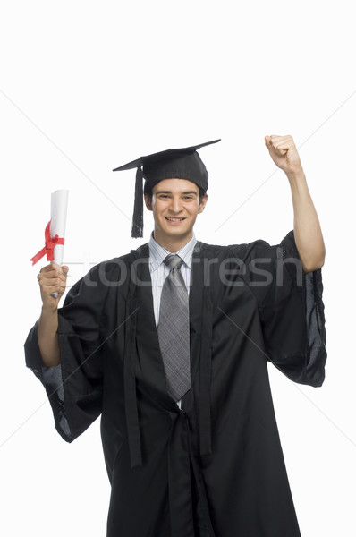 Porträt glücklich männlich Absolvent halten Diplom Stock foto © imagedb