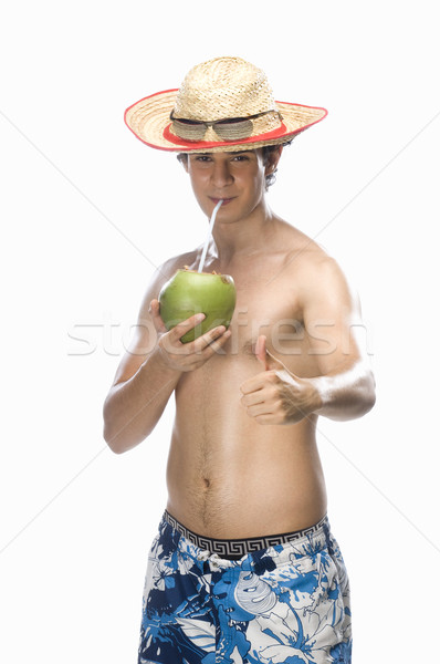 Człowiek pitnej mleko kokosowe komunikacji Zdjęcia stock © imagedb