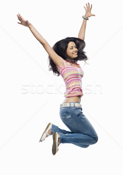 Jeune femme sautant femme jeunes souriant joie [[stock_photo]] © imagedb