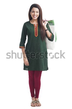 Portrait of a happy woman carrying shopping bags Stock photo © imagedb