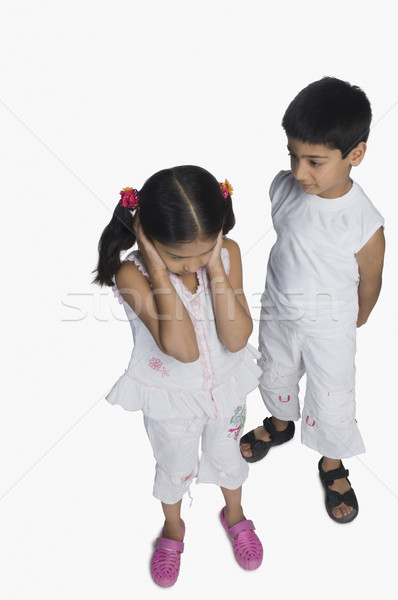 Ragazza orecchie fratello parlando bambini ragazzi Foto d'archivio © imagedb
